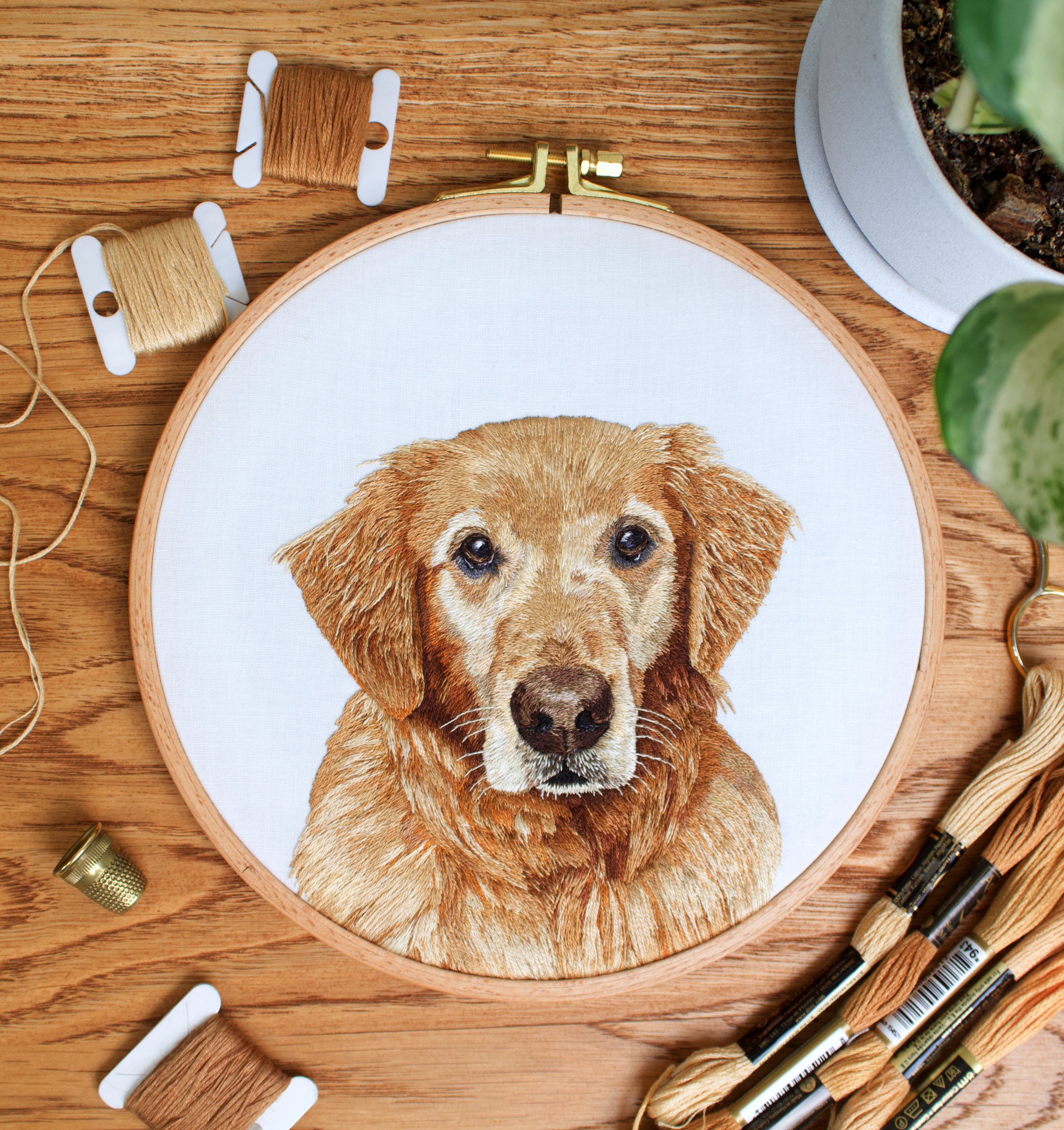Hand embroidered custom pet portrait of a golden retriever